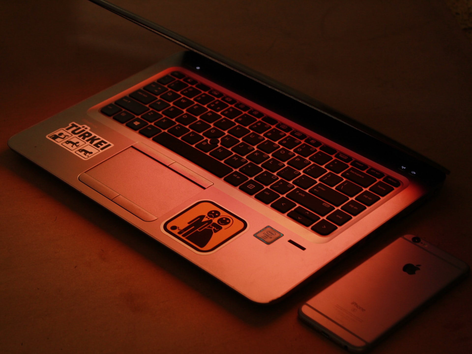 silver asus laptop computer on brown wooden table